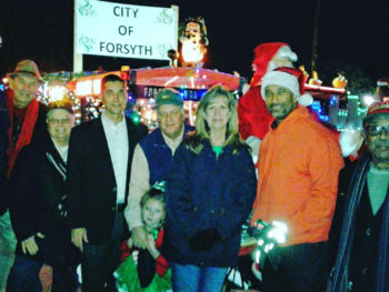 Picture of group of people facing camera during the Christmas parade