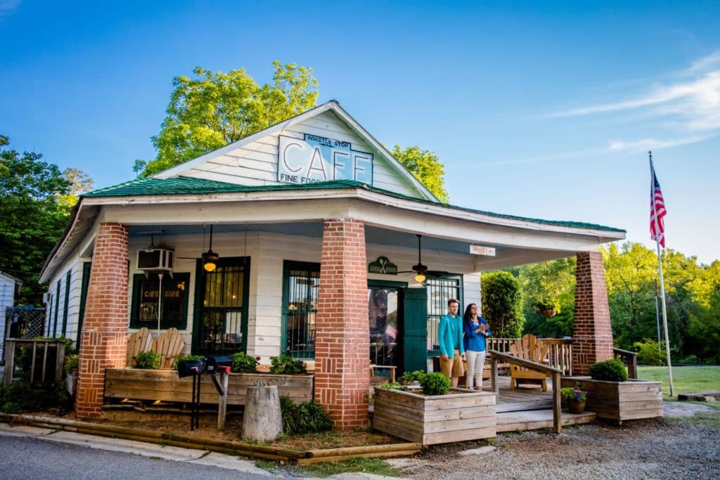 old fashioned cafe front porch veranda with brick columns - Whistle Stop Cafe in Historic Juliette, GA home to Fried Green Tomatoes